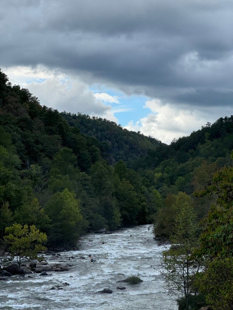 IMG_9304 View of a group of kayakers successfully navigating Grumpy's Ledge from the top of the put-in of the middle section of the Ocoee River. This was down the road from Pappaw's house and it's a place where the spirit of adventure has a constant prevalence.